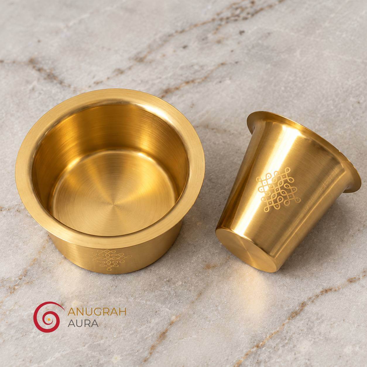 Solid brass dabara tumbler set with traditional engraved kolam design and golden finish