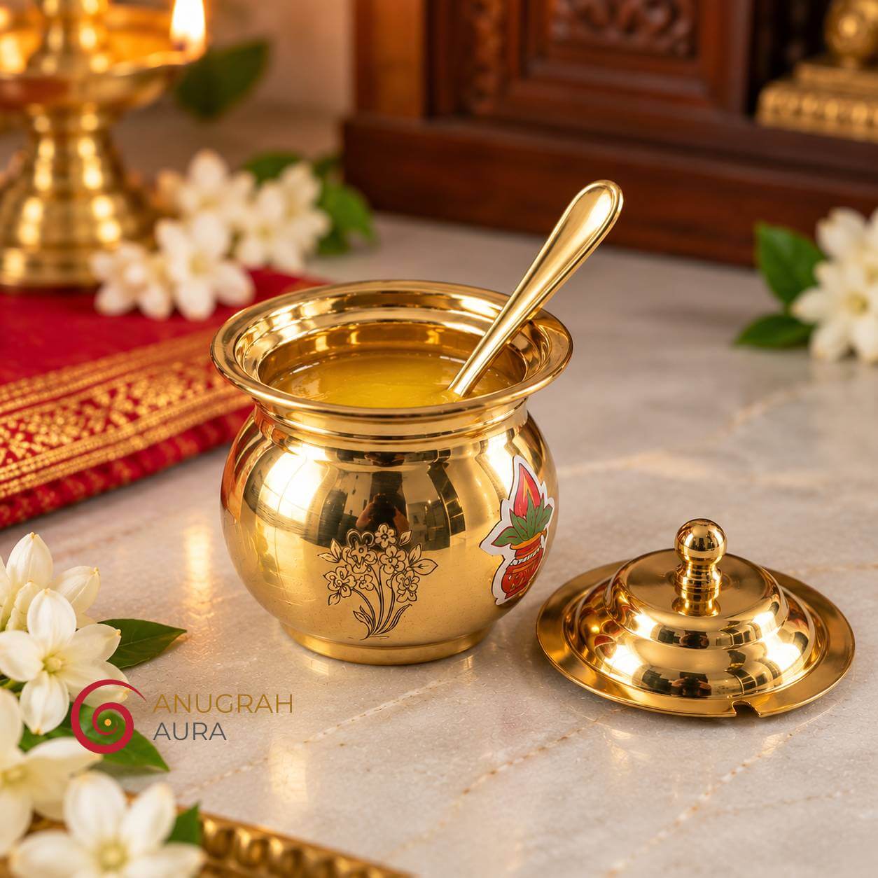 Open brass ghee container with matching brass spoon and lid